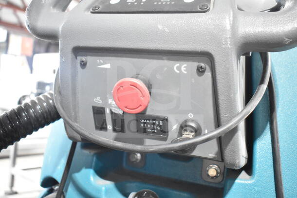 Tennant T5 Floor Cleaning Machine control panel, featuring switches, a red knob, and quartz hour meter. CE mark visible.