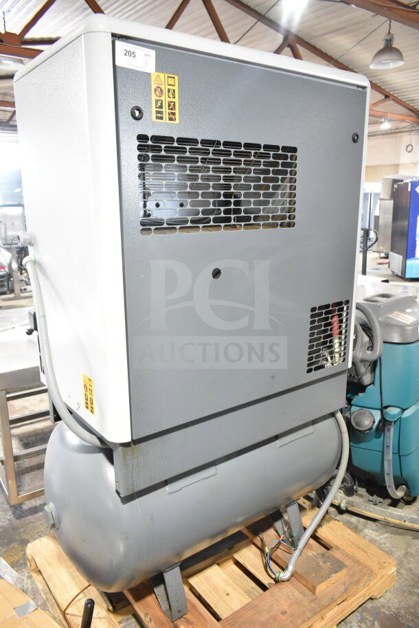 Atlas Copco GA11VSD Rotary Screw Air Compressor, model GA11VSD, in used condition with visible labels and ducting.