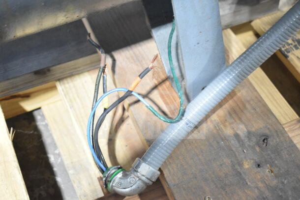 Atlas Copco GA11VSD rotary screw air compressor wiring and connections on wooden pallet.