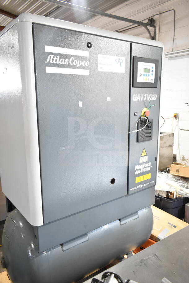 Atlas Copco GA11VSD rotary screw air compressor, excellent condition, control panel, branded labels, model GA11VSD.