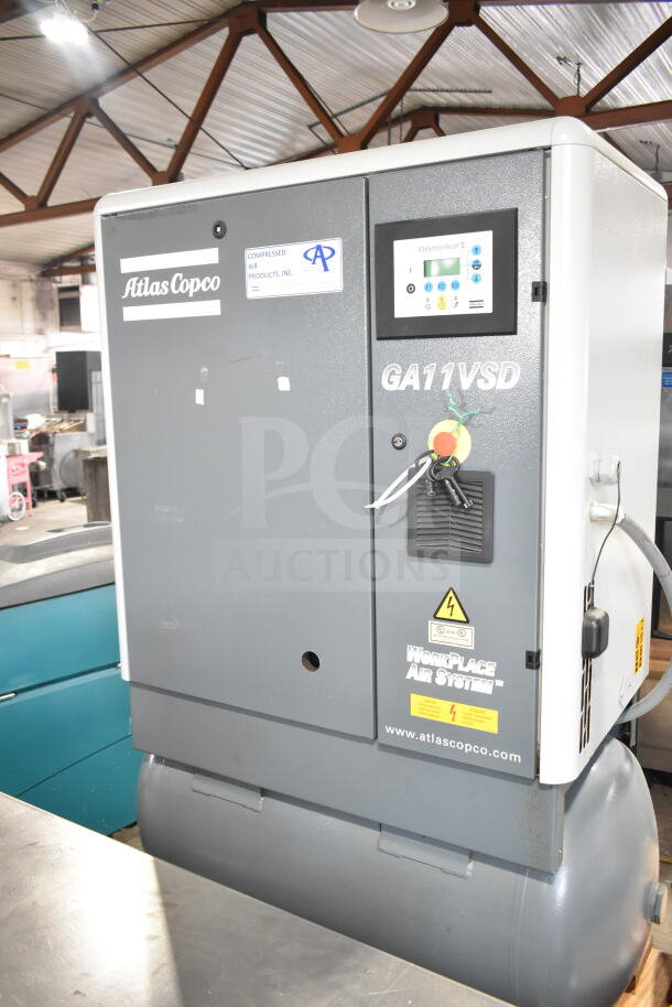 Atlas Copco GA11VSD rotary screw air compressor, Model GA11VSD, in good condition, control panel and labeling visible.