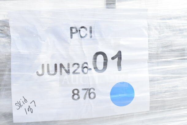 Transparent wrap covering items with visible label reading "PCI," "JUN26-01," and "876," marked "Skid 107."