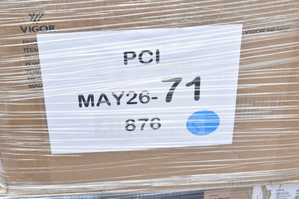 Cardboard packaging labeled "PCI MAY26-71 876" with Vigor branding, wrapped in transparent film. Auction lot includes various new items.