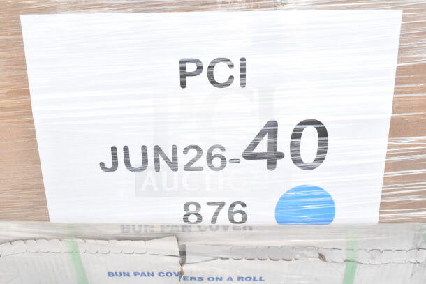 Cardboard box with label "PCI JUN26-40 876." Contains 26 assorted scratch and dent items: napkins, plates, lids, gloves.