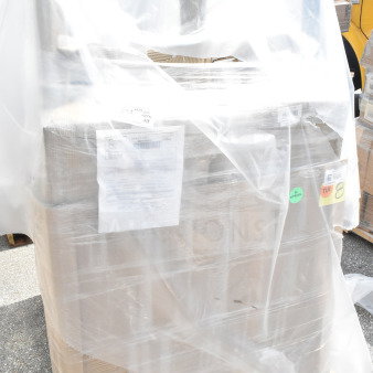 8 brand new Lancaster Table & Seating black wood bar stools, model 164BSCHLBLK, wrapped in plastic on a pallet.