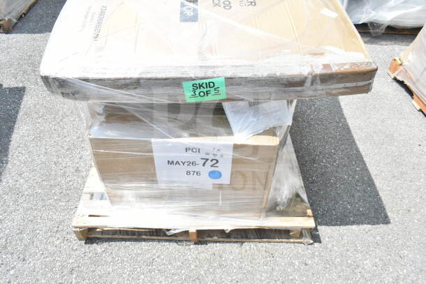 Pallet of scratch and dent items, including a wire shelf and mop sink, wrapped in plastic. Label: "SKID 3 of 5," "MAY26-72."