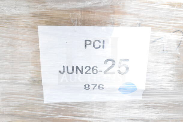 Clear plastic wrap with label "PCI JUN26-25 876" on a pallet containing brand new scratch and dent items.