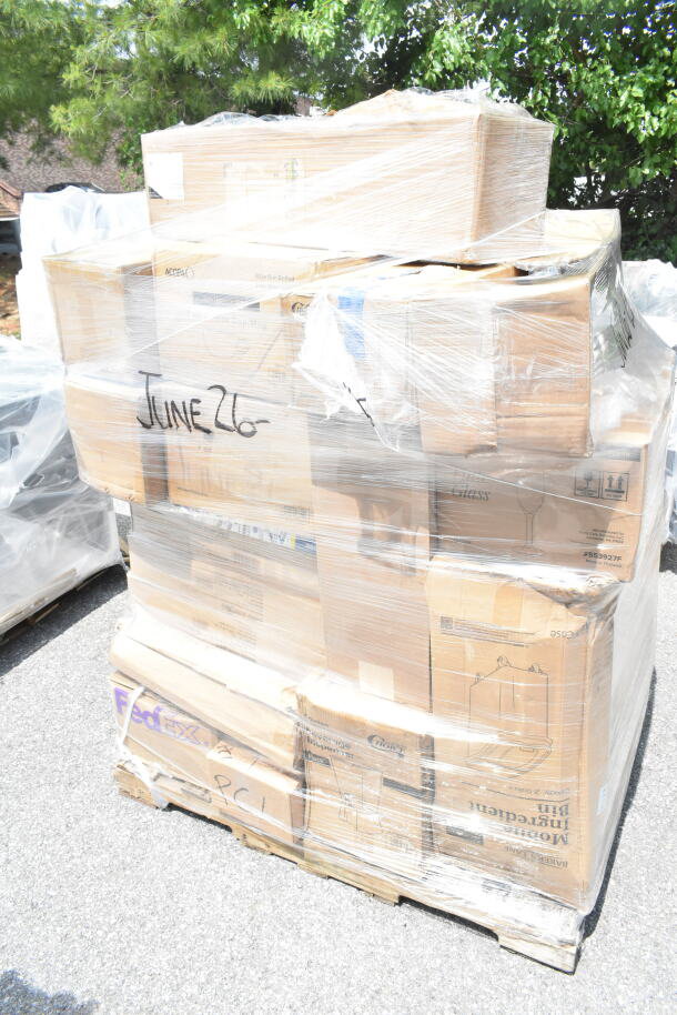 Pallet of boxed items including glasses, salad bowls, coffee cups, and server plates, labeled "June 26."