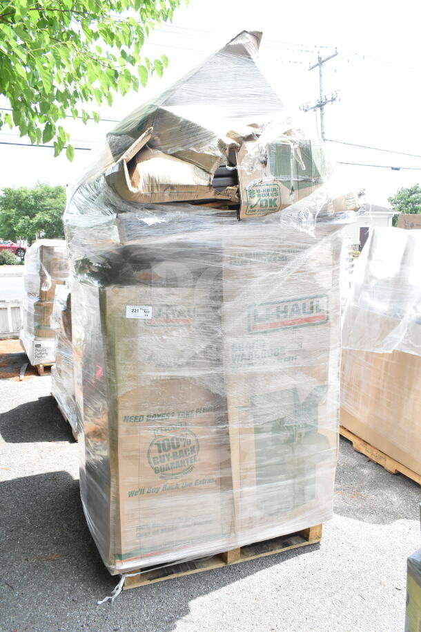 Wrapped pallet of U-Haul boxes labeled "100% Buy-Back Guarantee," containing 6 new scratch-and-dent items, including a back booth.