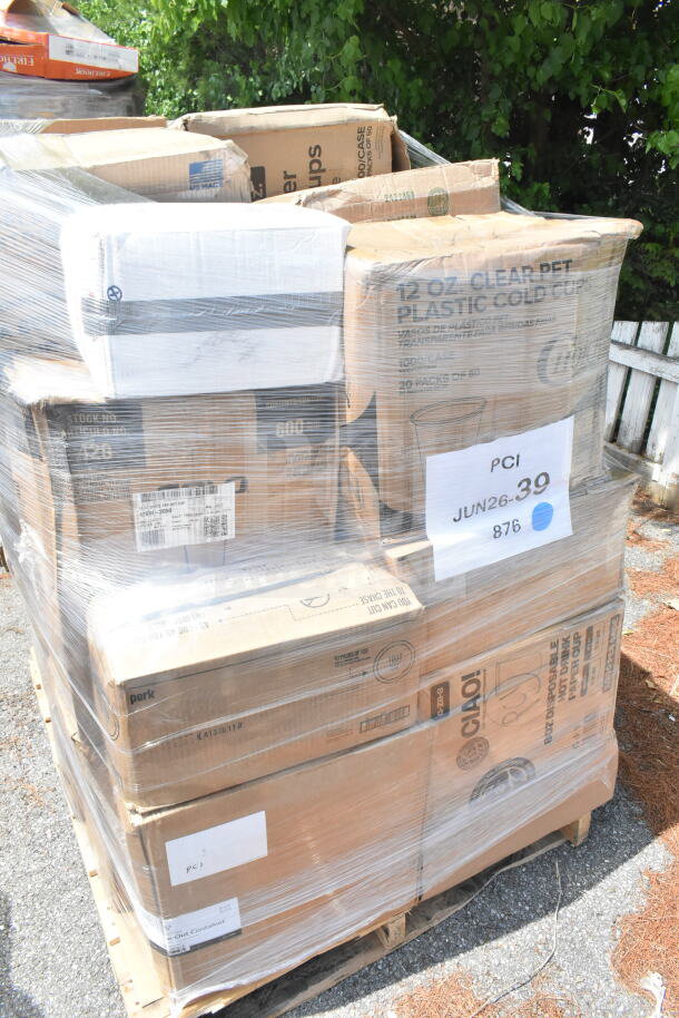Pallet of assorted scratch and dent items including napkins, forks, cups, and food trays. Labeled "26 times your bid" JUN26-39.