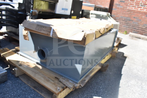 Brand new 320WD50L Watts WD-50-L grease trap, 100 lb. capacity, on a wooden pallet, minor packaging damage visible.
