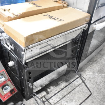 Backyard Pro Grill in new condition, includes original packaging, parts boxed. Sturdy frame, plug visible, labeled with item number 130.