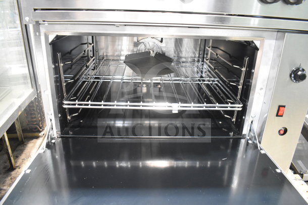 Brand new Vulcan 36C-6BP 6-burner range with convection oven, 36" liquid propane, 215,000 BTU, interior view.