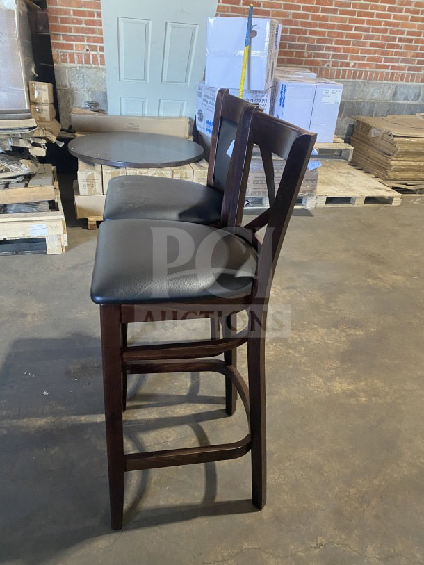 Brand new bar stool, mahogany finish, cushion back, black vinyl seat, commercial-grade, excellent condition.