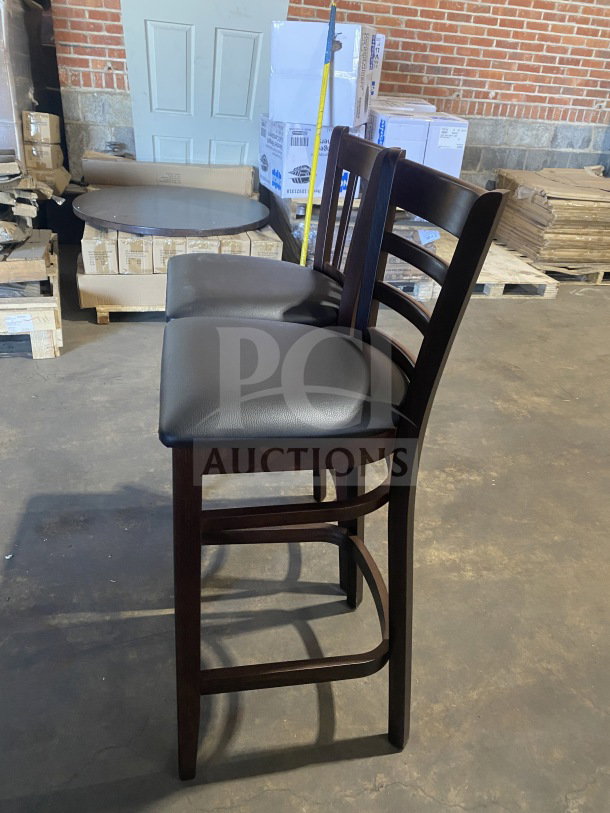 Brand new mahogany finish wood bar stool, cushion back, black vinyl seat, excellent condition, commercial grade.