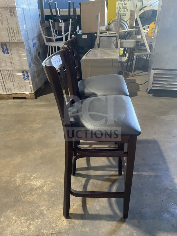 Brand new mahogany finish wood bar stool with black vinyl seat, cushion back, commercial quality. Auction label: 2X2.