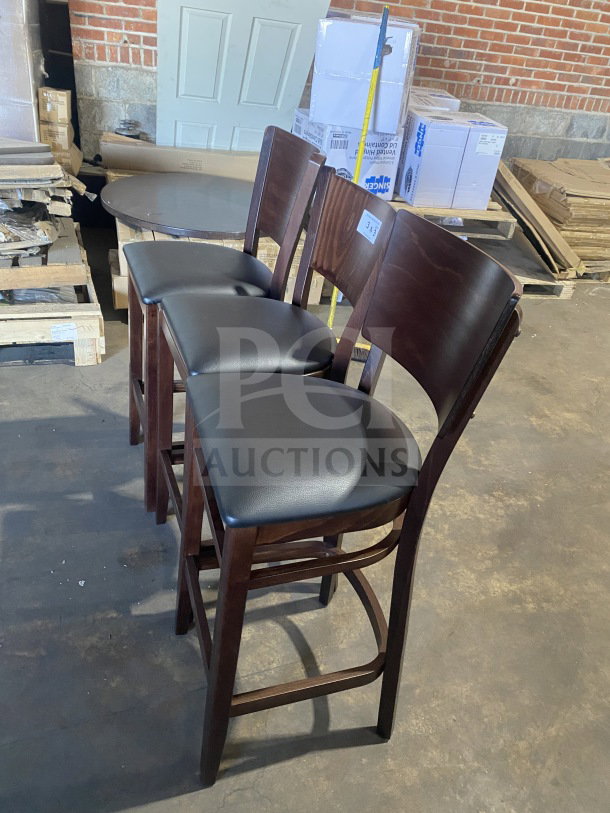 Brand new commercial bar stools with mahogany finish, cushion back, and black vinyl seat. Set of three.