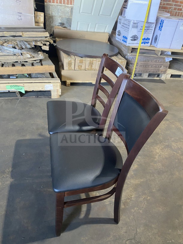 Brand new commercial mahogany finish dining chairs, wood frame, black vinyl seats, excellent condition, set of two.