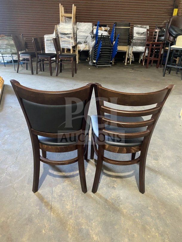 Brand new commercial dining chairs, mahogany wood finish, black vinyl seats, ladder-back design, two chairs included.
