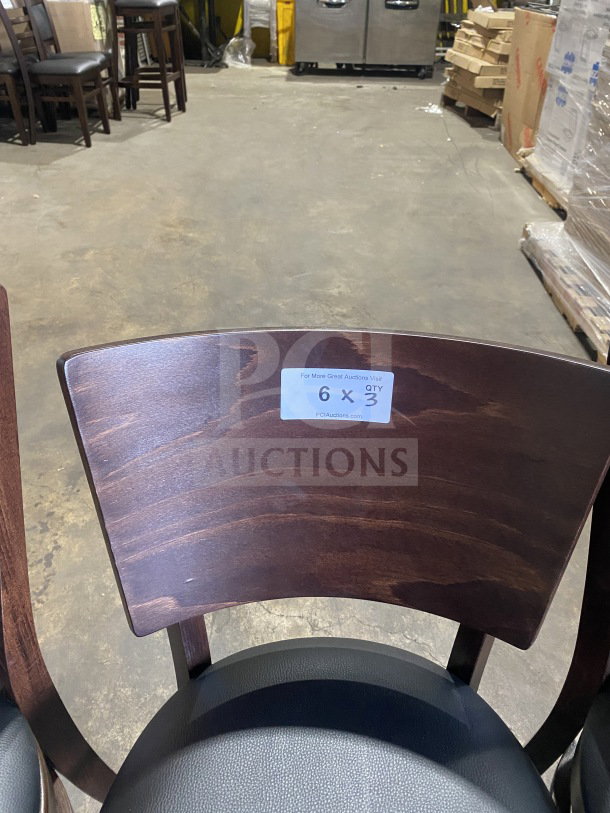 Brand new mahogany wood dining chair with black vinyl seat. Commercial quality, table-height, labeled for auction lot.