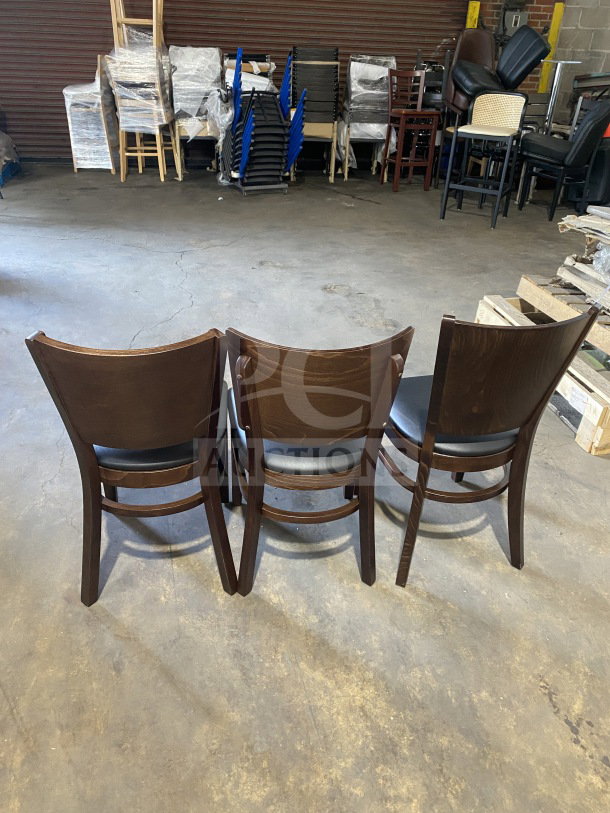 Brand new commercial dining chairs in mahogany finish with black vinyl seat, table-height, set of three, pristine condition.