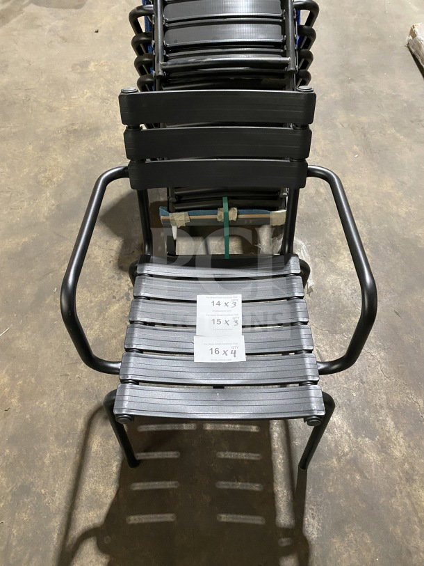 Brand new Houe ReClips stacking outdoor dining armchair, recycled polymer, sleek black design, perfect condition, visible size tags.