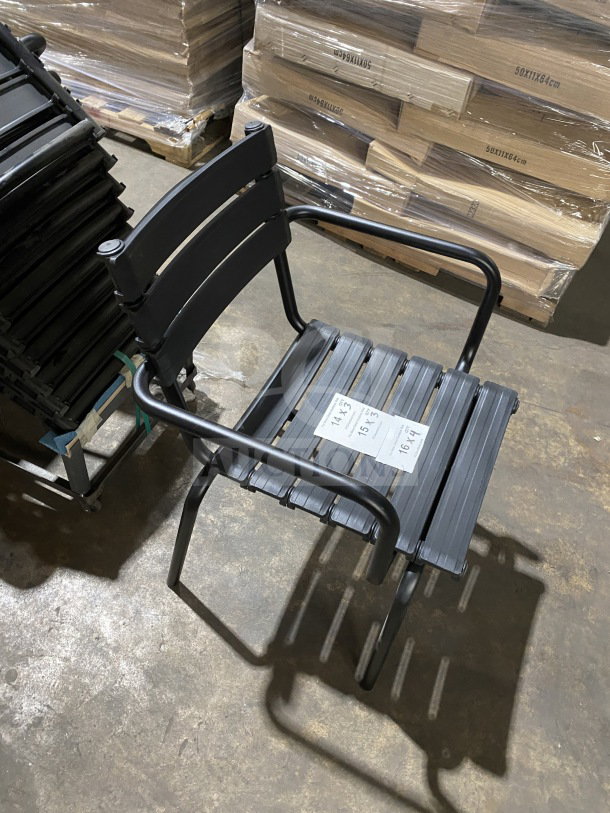 BRAND NEW Houe ReClips stacking armchair in recycled polymer. Features black slatted seat and back, metal arms, condition excellent.