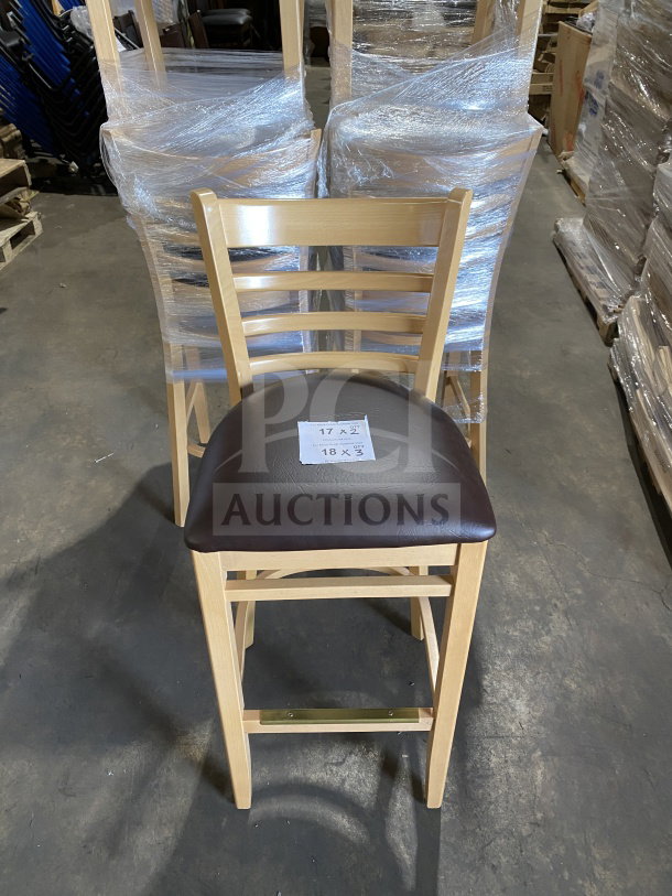 Brand new commercial wood ladder back chair with dark brown vinyl seat, natural finish, assembled, features dimensions tag.