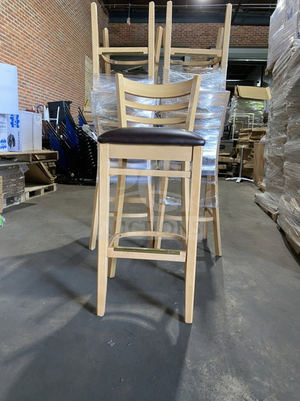 Brand new assembled wood ladder back chair with dark brown vinyl seat; commercial use, natural finish, pack of two.