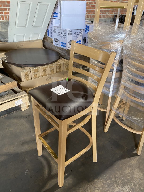 Brand new commercial wood ladder back chair with natural finish and dark brown vinyl seat, fully assembled.