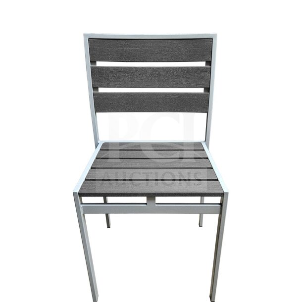 Brand new commercial outdoor teak chair with gray slats, featuring a sturdy frame, ideal for patio use.