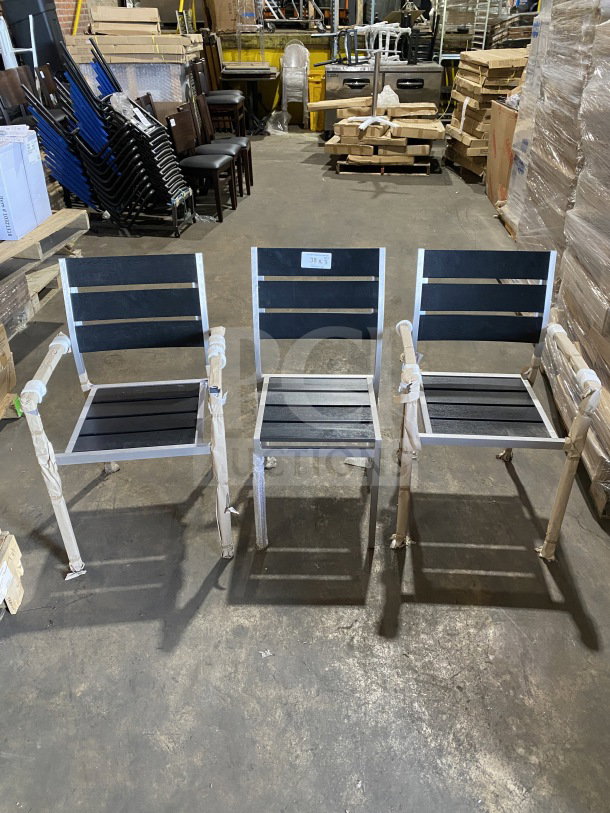 Brand new commercial outdoor teak chairs with black slats, set of three. Cushioned seats, durable frame, pristine condition.