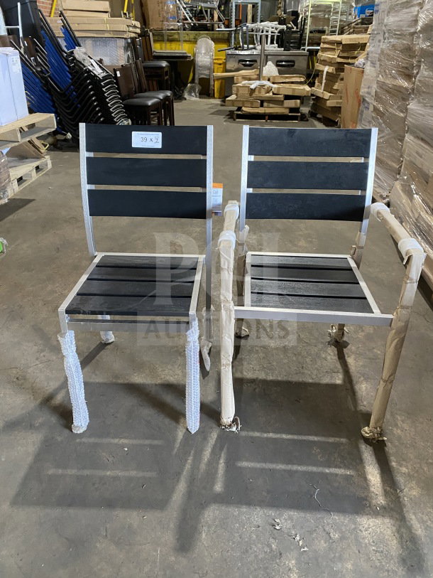 Brand new commercial outdoor teak chair with black slats. Protective wrap on legs. Includes a label "39 x 2".