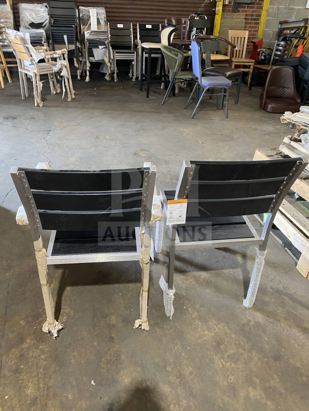 Brand new commercial outdoor teak chair with black slats, protective wrapping on legs, high durability, ideal for patios.