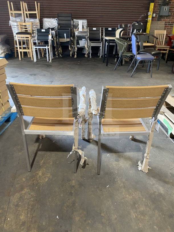Brand new commercial aluminum outdoor arm chairs with tan synthetic teak slats, stackable design, protective packaging.
