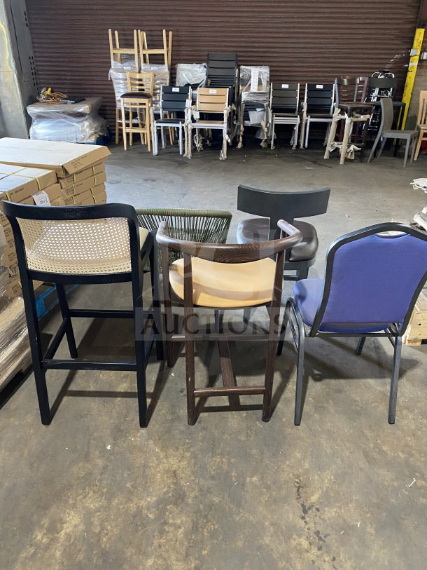 Assorted new commercial chairs in warehouse, featuring diverse designs and materials. Sample lot.