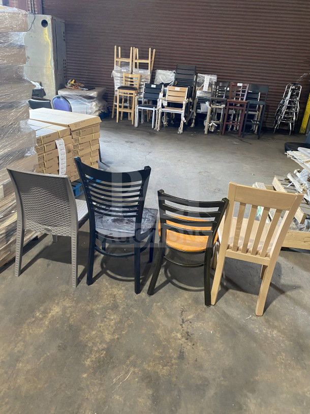 Brand new commercial bar height seating sample lot, featuring four different chair designs, stacked in warehouse setting.