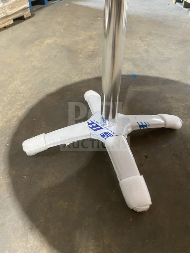 Brand new commercial stainless steel table, model D36, with polished base, dining height, protective wrapping visible.