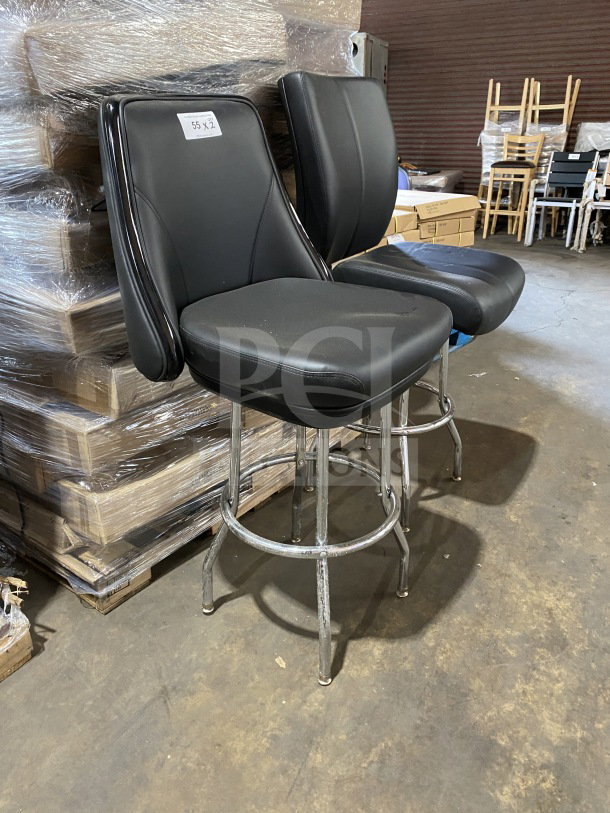 Brand new commercial chrome frame swivel bar stool with black vinyl bucket seat. Packaged in warehouse, tag reads "55 x2."