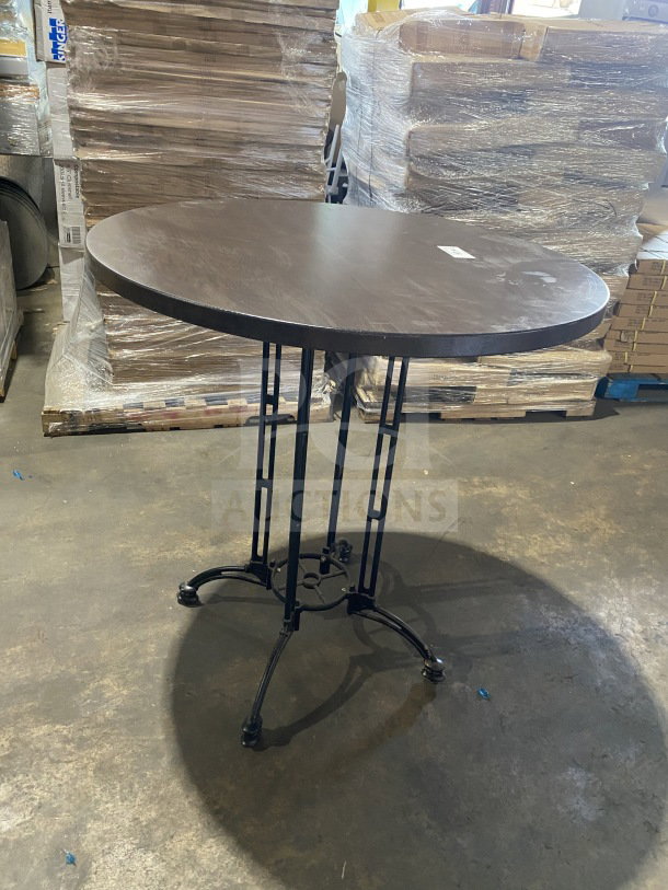 Round commercial 42" bar height table, composite material, new, for indoor/outdoor use, metal base, dark finish.