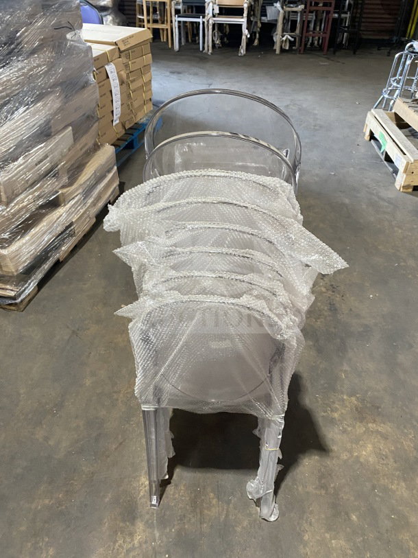 Brand new GA Commercial transparent polycarbonate stackable side chair with oval back, wrapped in protective packaging.