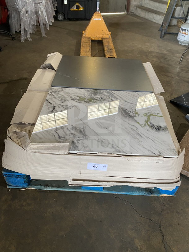 Brand new commercial restaurant and cafe marble-style table tops, on pallet, 60 quantity tag visible.