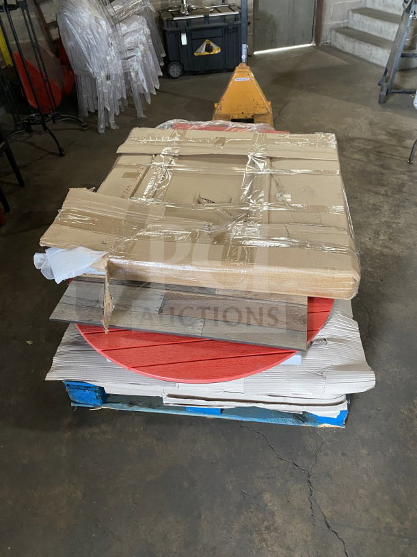 Brand new commercial restaurant and cafe table tops stacked on a pallet. Mixed colors and styles, wrapped in protective packaging.