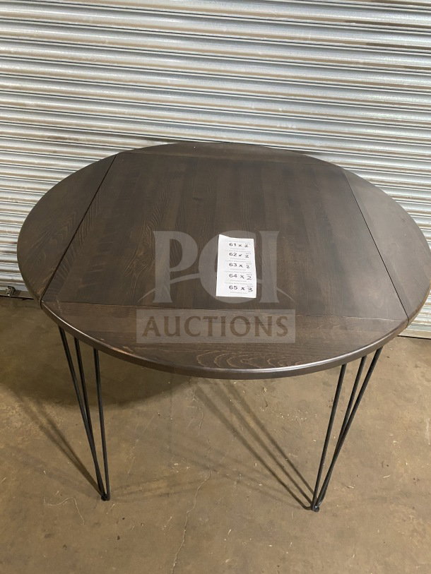 Brand new 42" round composite bar height table with hairpin legs, suitable for indoor/outdoor use.