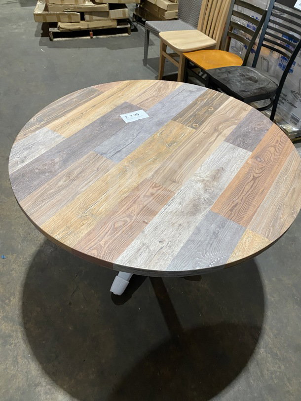 BRAND NEW 42" round OCS composite dining table with barn wood plank design and polished base, Model DW42.