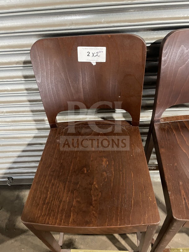 Modern style wooden bar height stools, new condition, dark wood finish, labeled "2XQTY" indicating quantity.