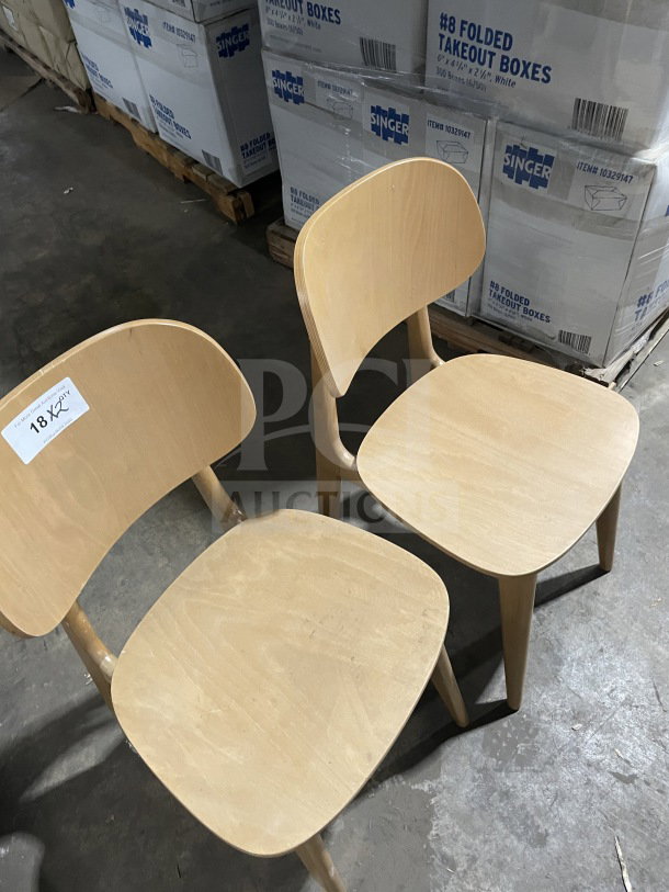 New commercial natural finish wood Emma dining chair, upholstered seat, indoor use, set of 2, marked with "18 X2".