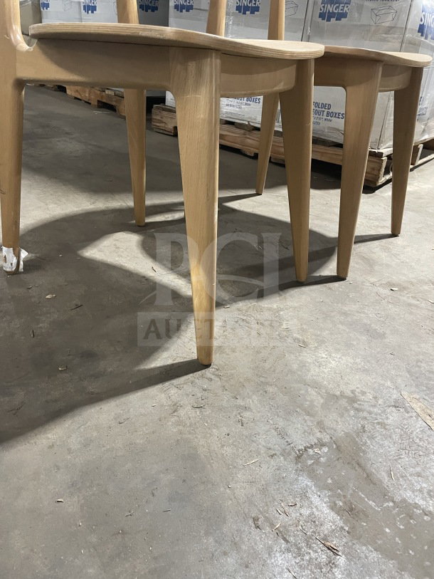 Natural finish wood Emma side chair with upholstered seat, commercial use, new condition, dining height.