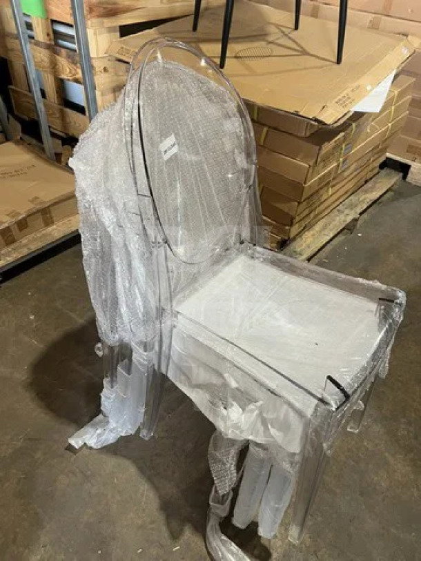 Brand new GA Ghost transparent polycarbonate stackable side chair with oval back, wrapped in protective material.