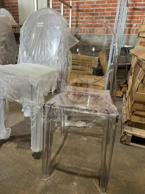 BRAND NEW GA Ghost Chair, transparent polycarbonate, oval back, stackable, sealed in packaging. Suitable for indoor/outdoor use.